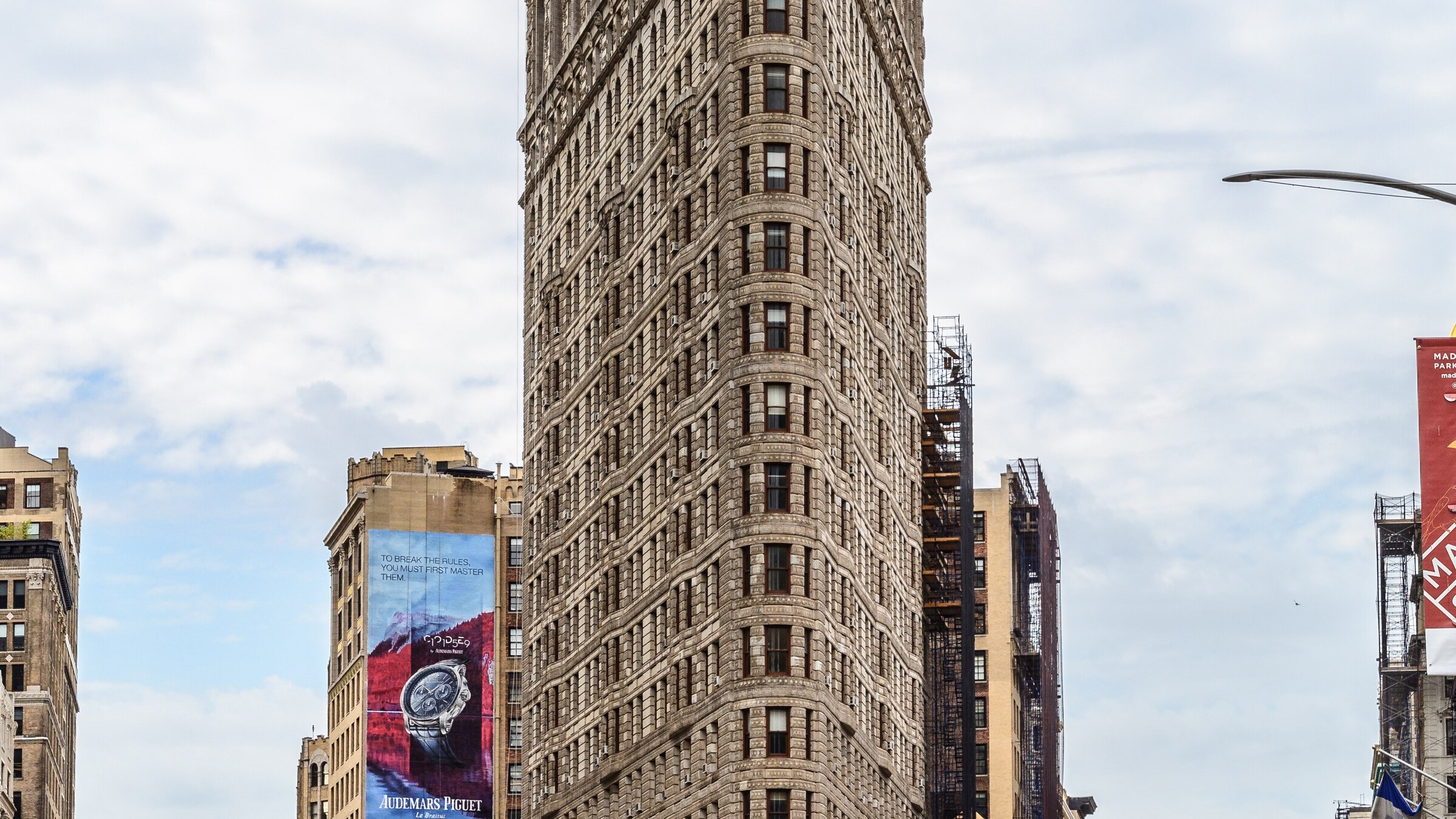 Daytime view of the Flatiron Building limestone facade in Midtown Manhattan